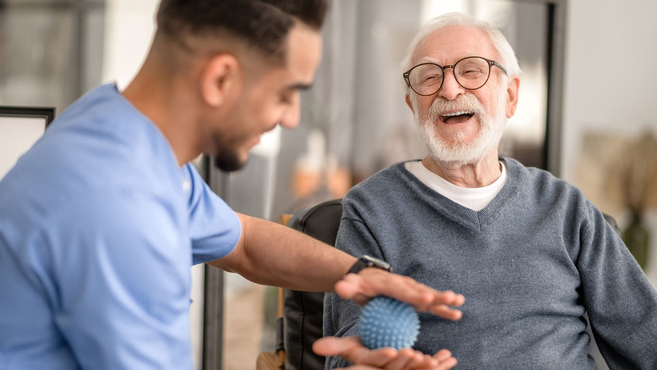 Older man receiving physical therapy treatment